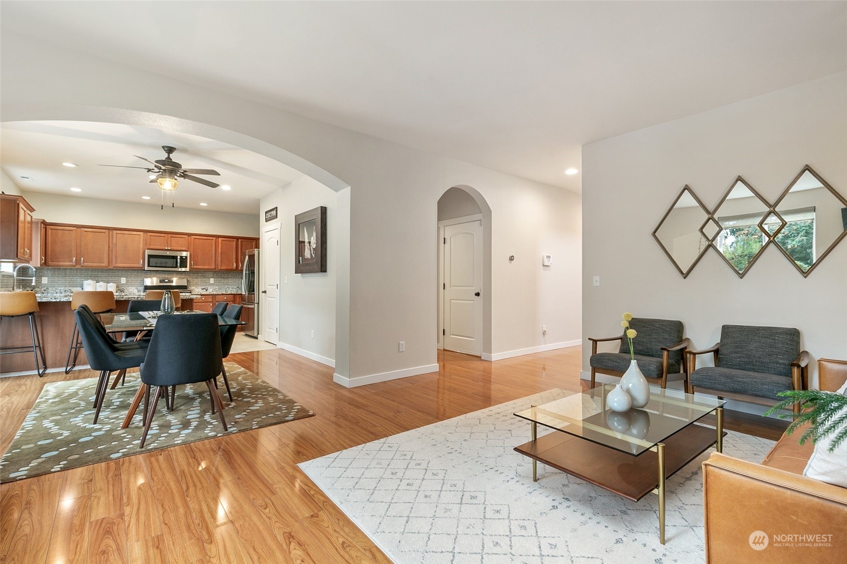 573 Field Place Northeast Renton, WA 98059 - Photo 6 of 34 a living room with dining room and kitchen view