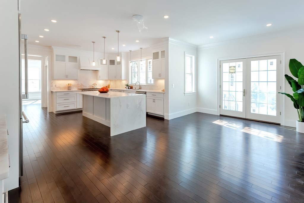 9 Hawthorne Road Lexington, MA 02420 - Photo 11 of 38 a living room with stainless steel appliances kitchen island hardwood floor and a large window