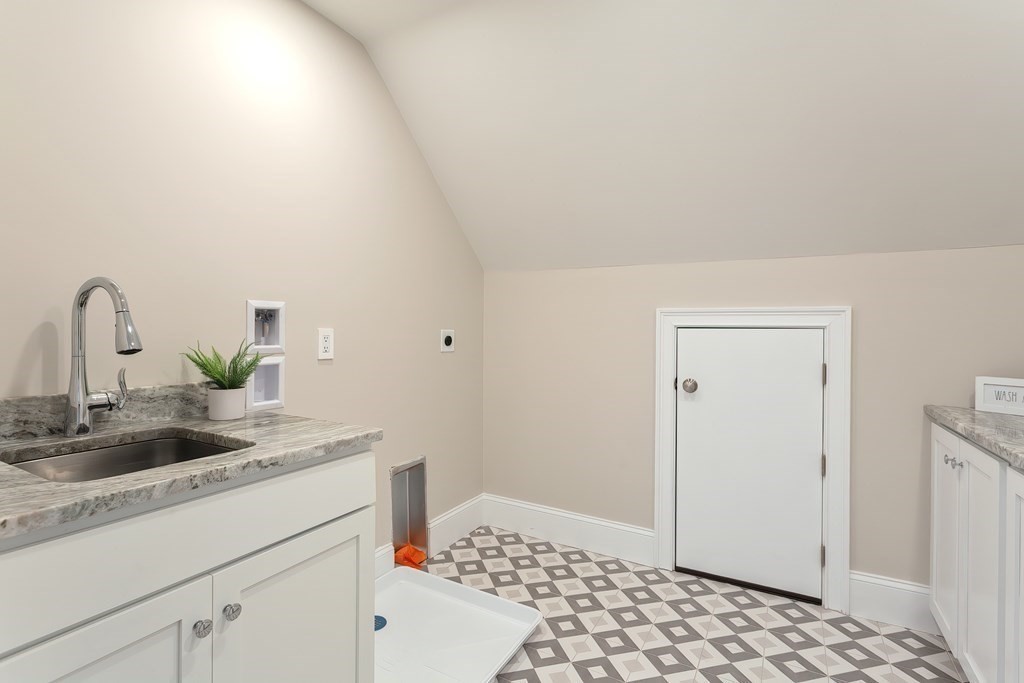 9 Hawthorne Road Lexington, MA 02420 - Photo 31 of 38 a bathroom with a sink and a mirror