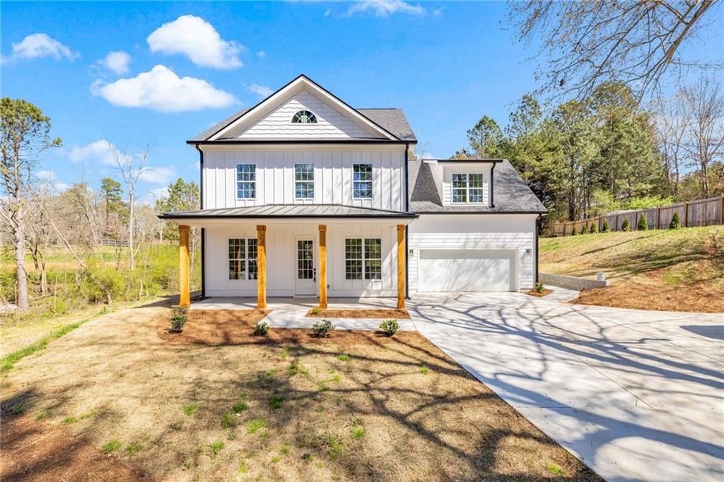 8110 Knight Road Gainesville, GA 30506 - Photo 1 of 1 a front view of a house with a yard