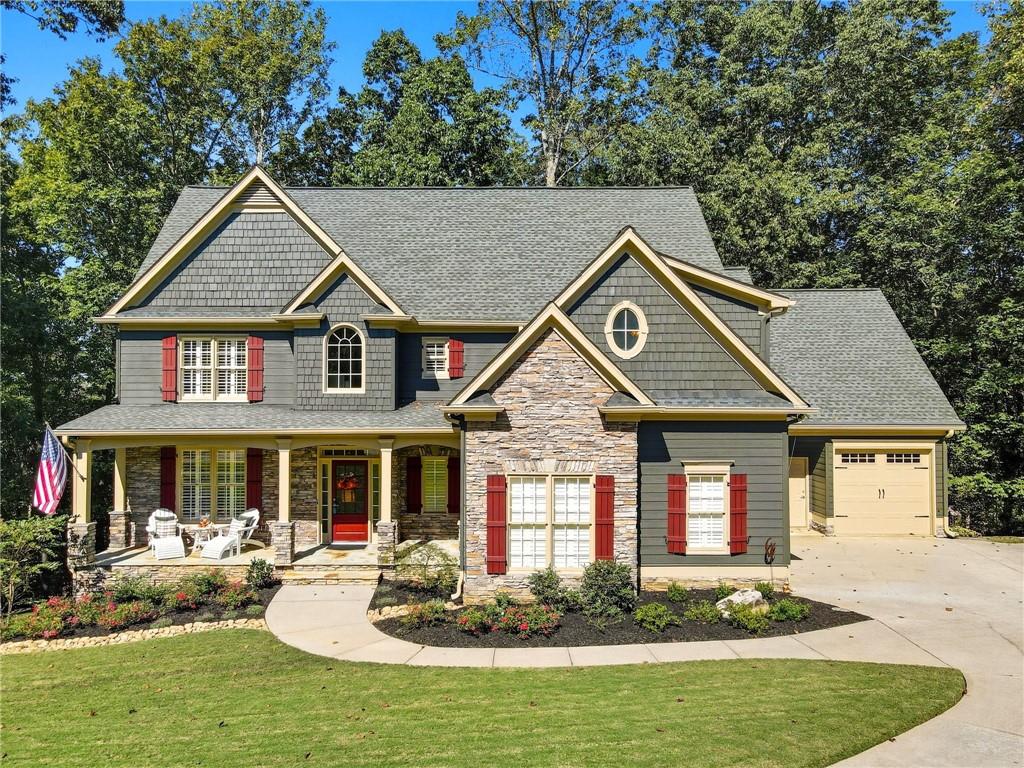208 North Ridgeview Court Canton, GA 30115 - Photo 55 of 59 a front view of a house with garden