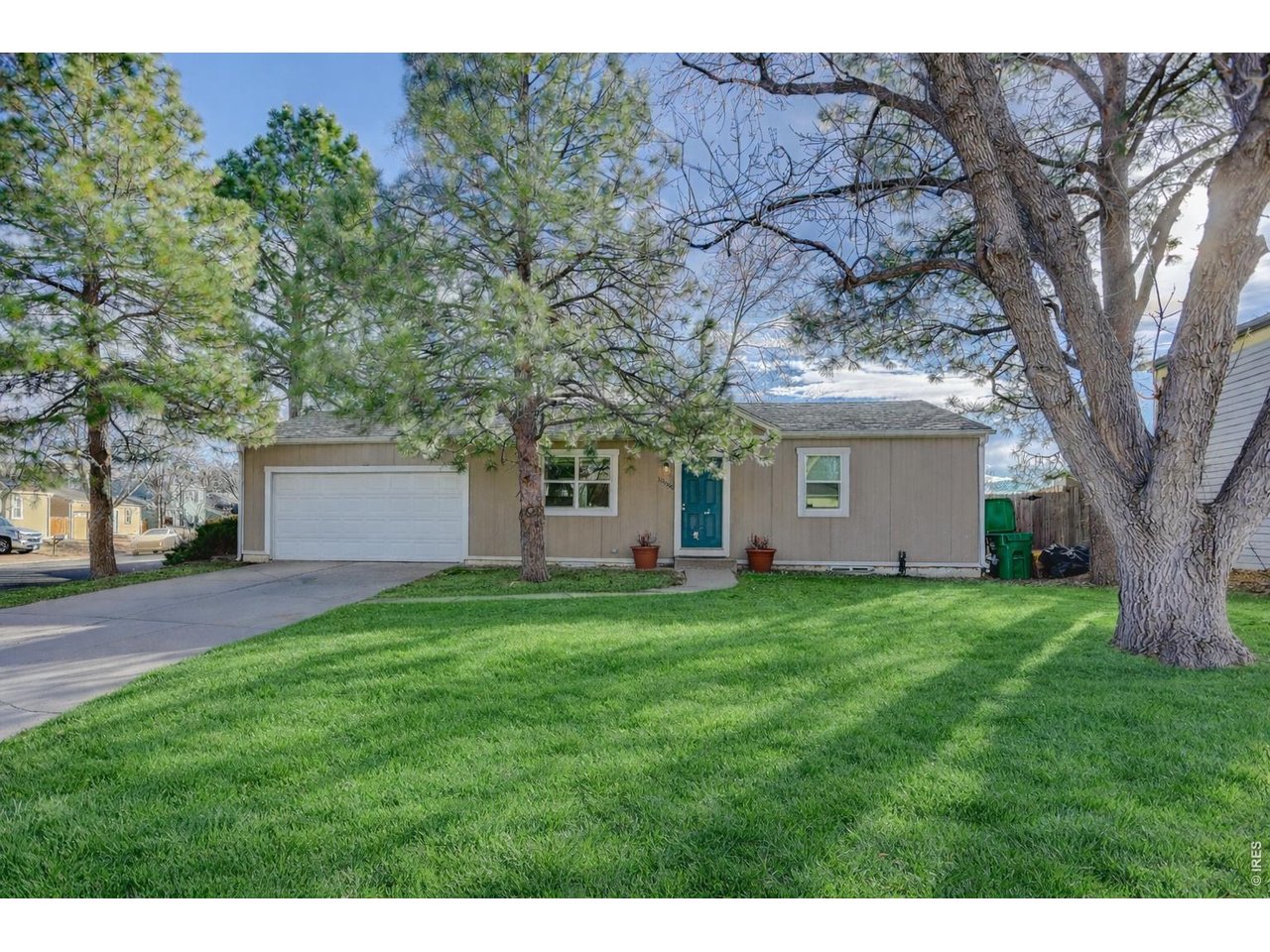 10696 Newcombe Street Westminster, CO 80021 - Photo 1 of 36 a house view with a garden space
