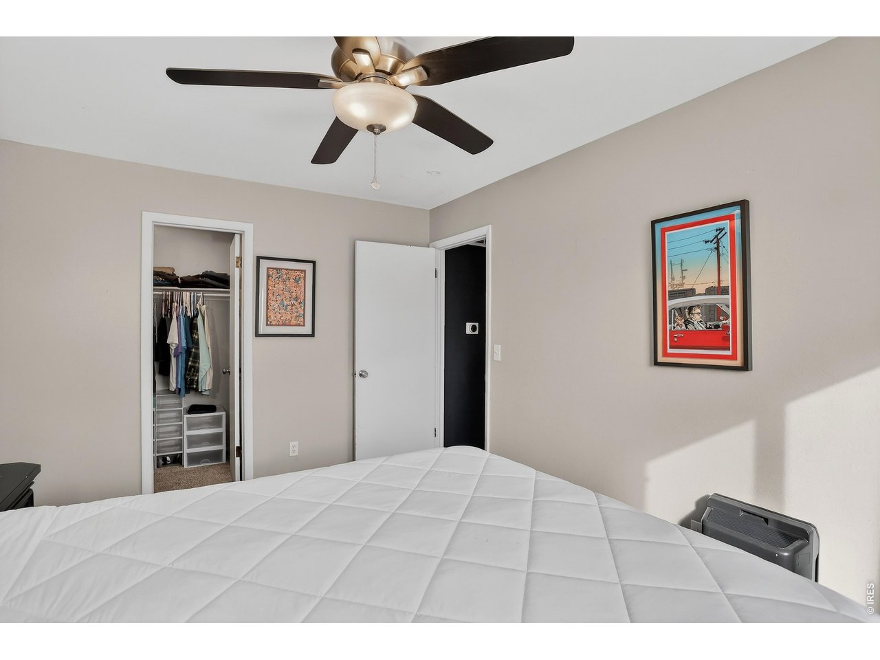 10696 Newcombe Street Westminster, CO 80021 - Photo 17 of 36 a bedroom with a bed and a dresser