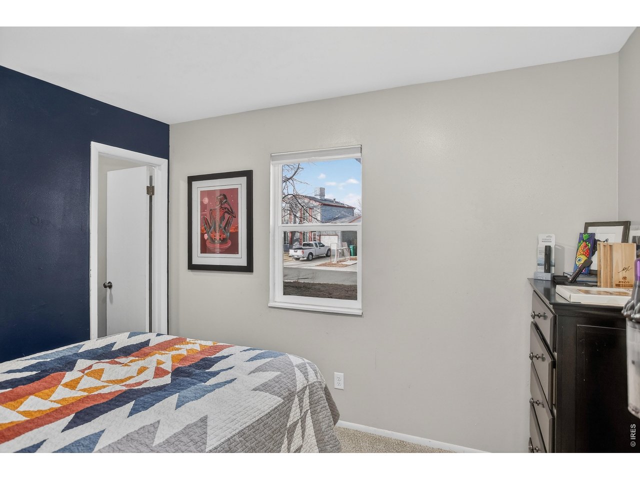 10696 Newcombe Street Westminster, CO 80021 - Photo 21 of 36 a bedroom with a bed and a desk