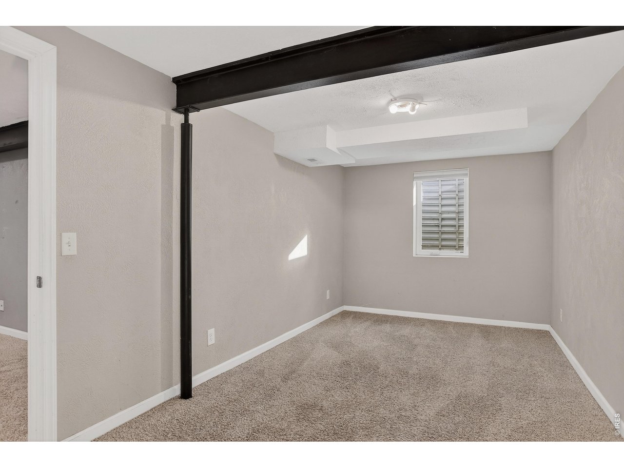 10696 Newcombe Street Westminster, CO 80021 - Photo 25 of 36 a view of an empty room with a window