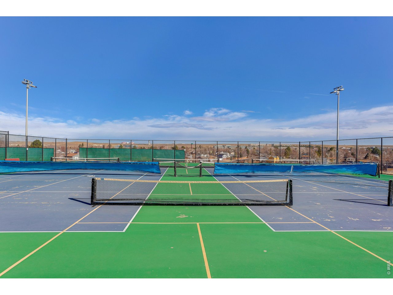 10696 Newcombe Street Westminster, CO 80021 - Photo 35 of 36 a view of a tennis court