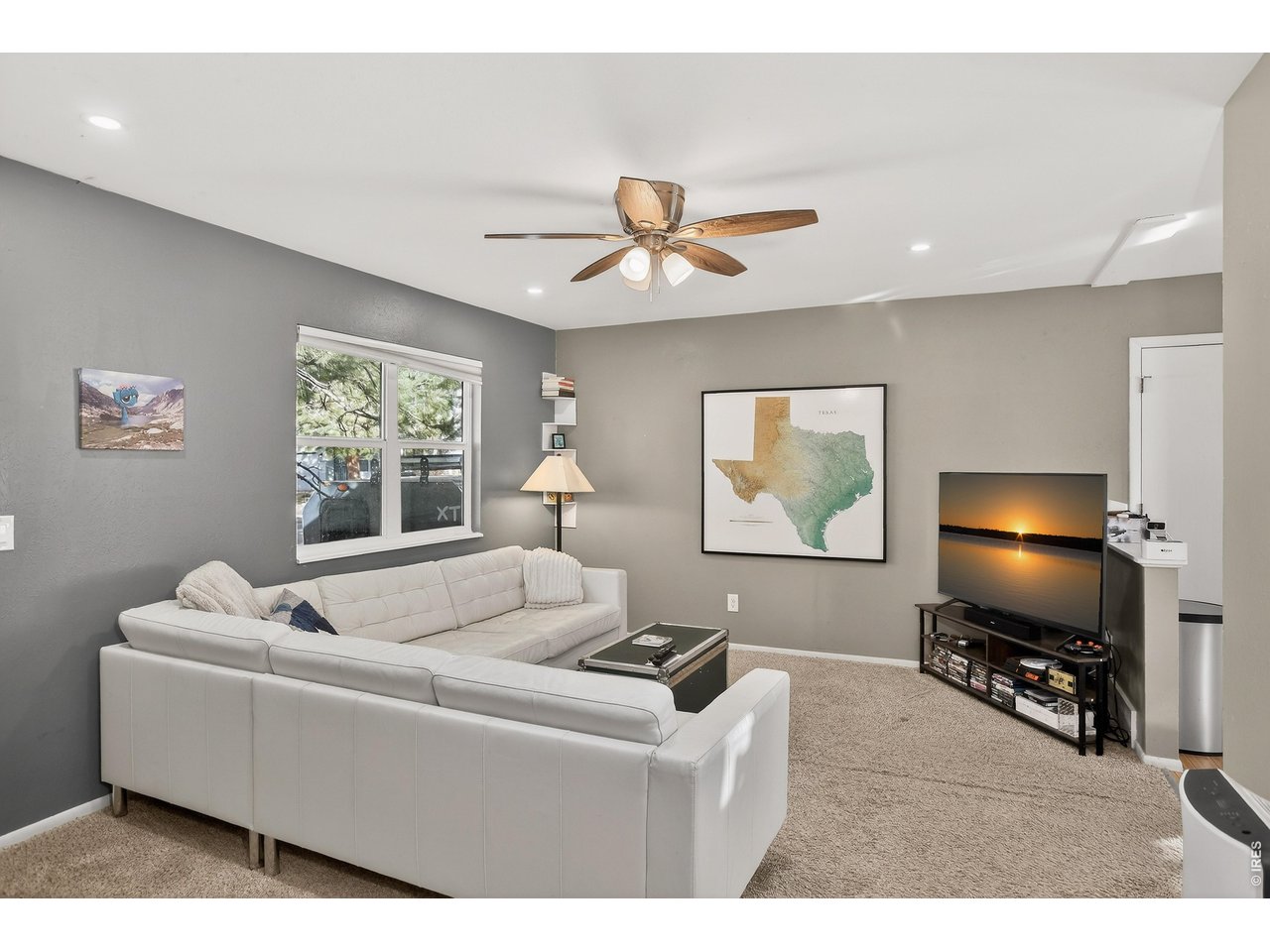 10696 Newcombe Street Westminster, CO 80021 - Photo 5 of 36 a living room with furniture and a flat screen tv