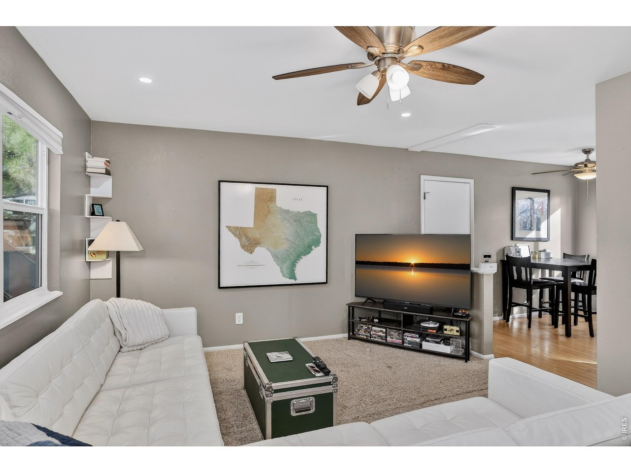 10696 Newcombe Street Westminster, CO 80021 - Photo 6 of 36 a living room with furniture and a flat screen tv