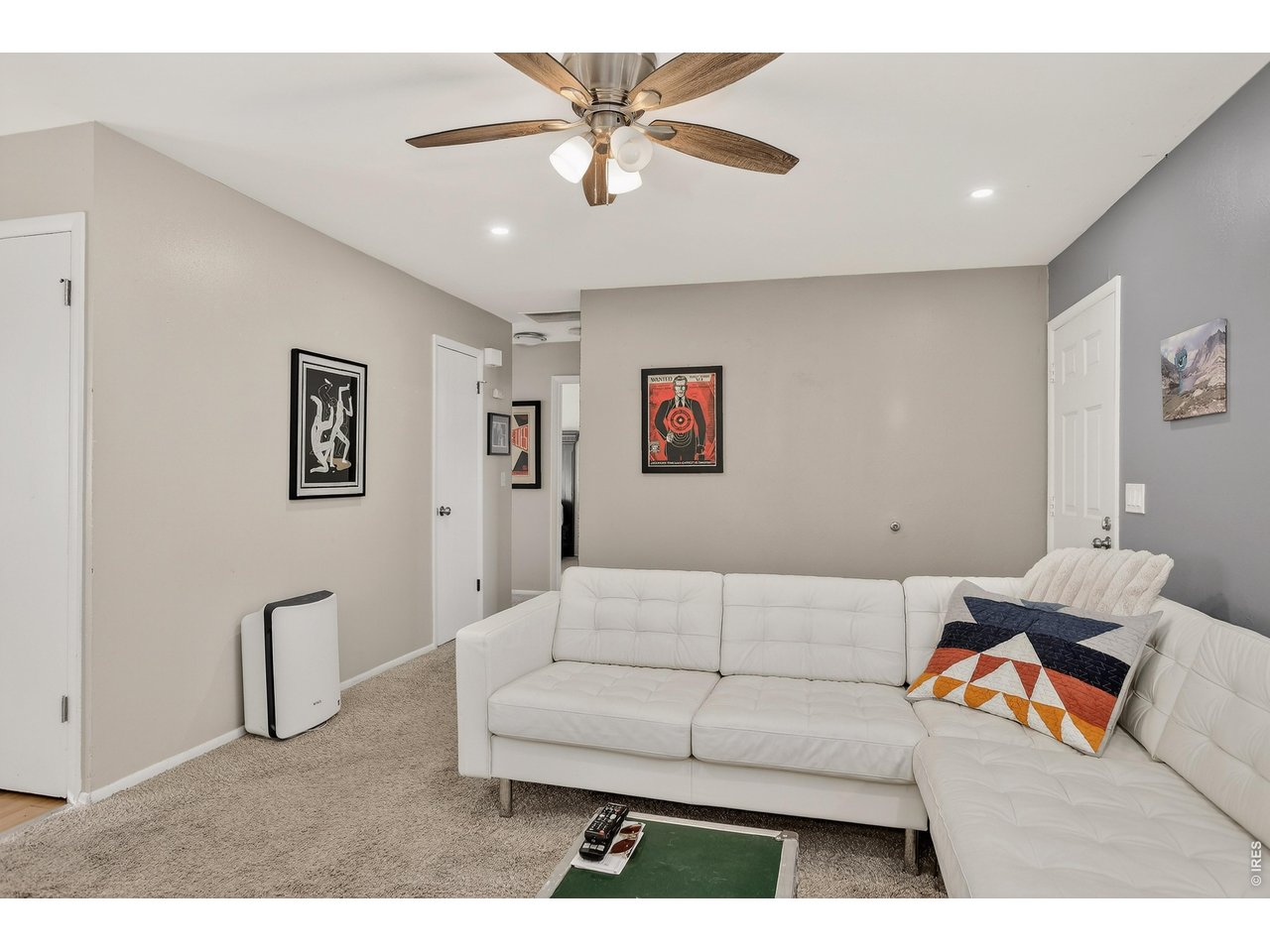 10696 Newcombe Street Westminster, CO 80021 - Photo 7 of 36 a living room with furniture and a ceiling fan