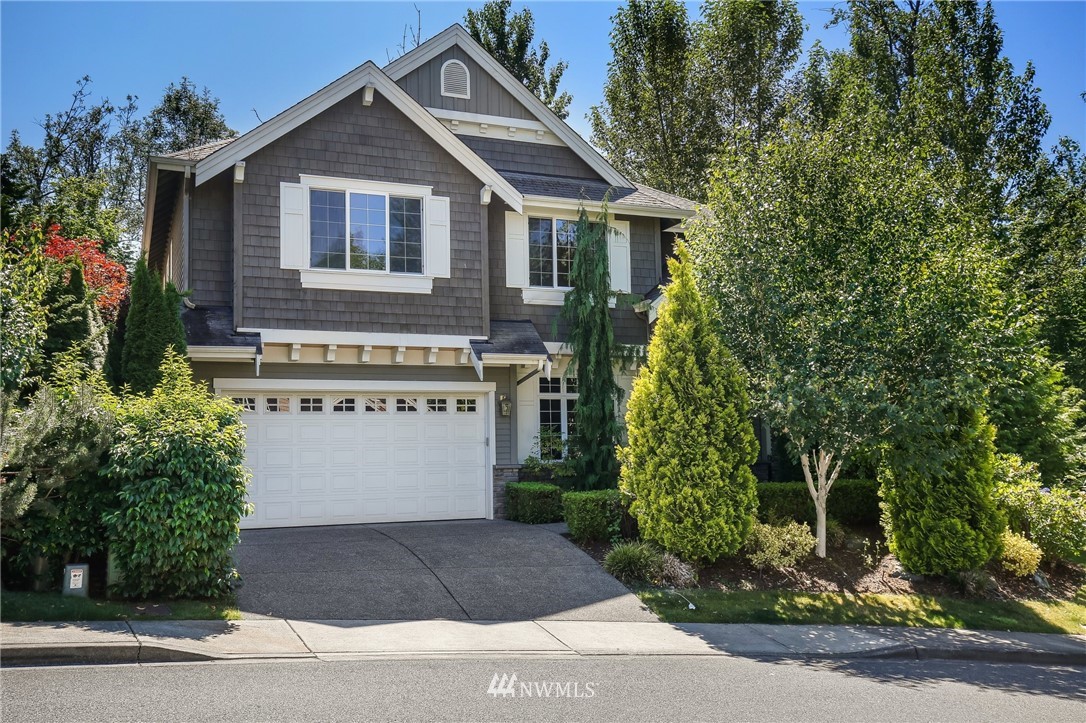 807 South 36th Place Renton, WA 98055 - Photo 2 of 39 a front view of a house with a yard and garage
