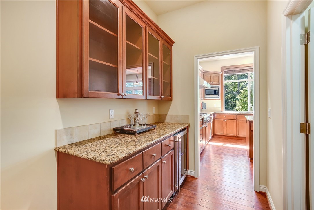 807 South 36th Place Renton, WA 98055 - Photo 12 of 39 a kitchen with a stove and a wooden cabinets