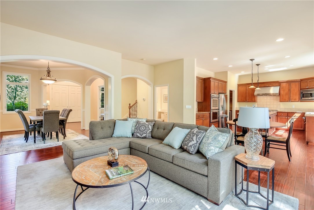807 South 36th Place Renton, WA 98055 - Photo 16 of 39 a living room with furniture kitchen and a table