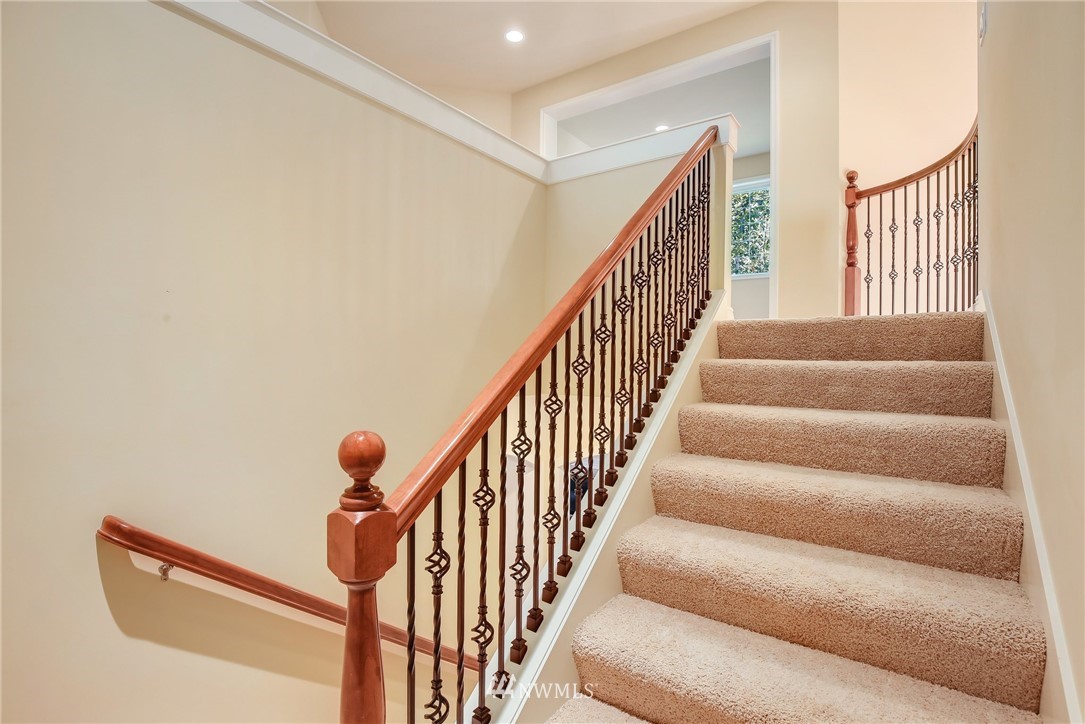 807 South 36th Place Renton, WA 98055 - Photo 20 of 39 a view of staircase with lots of frames on wall