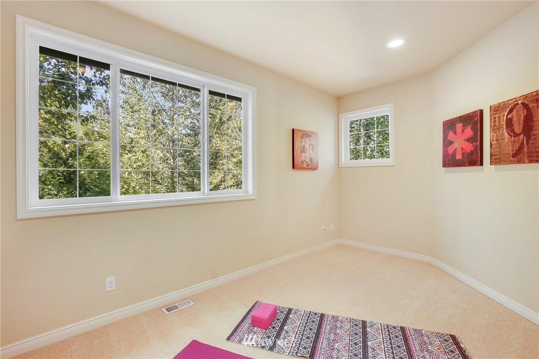 807 South 36th Place Renton, WA 98055 - Photo 23 of 39 a bathroom with a bathtub and a window