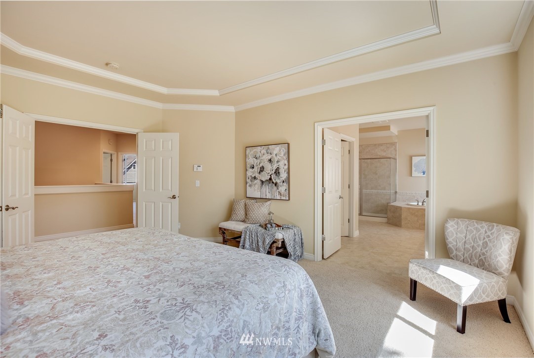 807 South 36th Place Renton, WA 98055 - Photo 25 of 39 a bedroom with a large bed and furniture