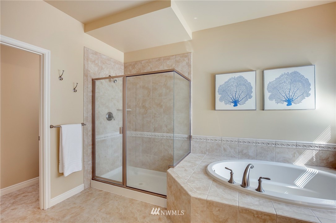 807 South 36th Place Renton, WA 98055 - Photo 27 of 39 a bathroom with a bathtub and a shower