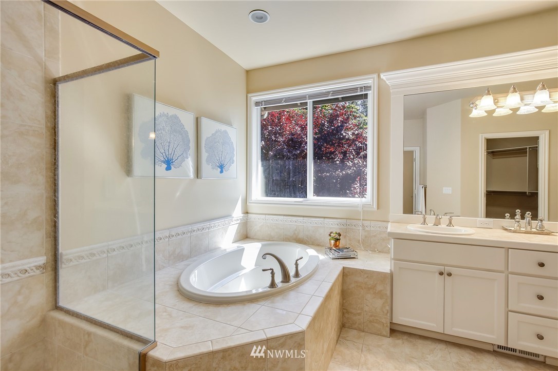 807 South 36th Place Renton, WA 98055 - Photo 28 of 39 a bathroom with a sink and a mirror