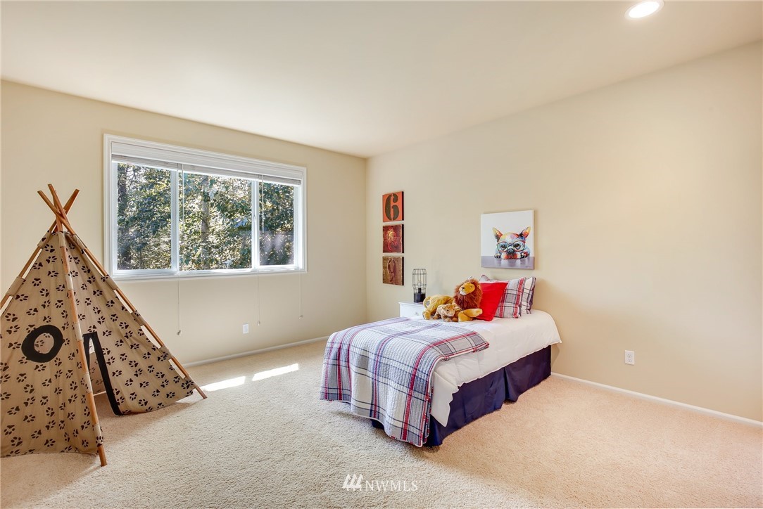 807 South 36th Place Renton, WA 98055 - Photo 30 of 39 a bedroom with a bed and a window