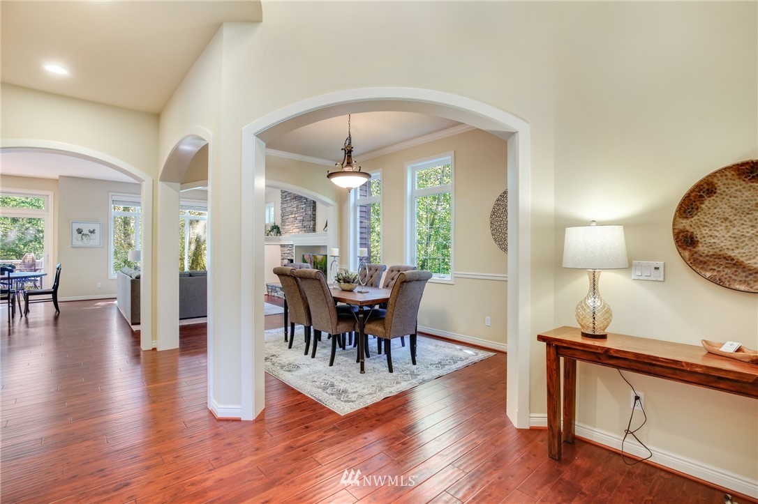 807 South 36th Place Renton, WA 98055 - Photo 4 of 39 a view of a dining room with furniture and wooden floor