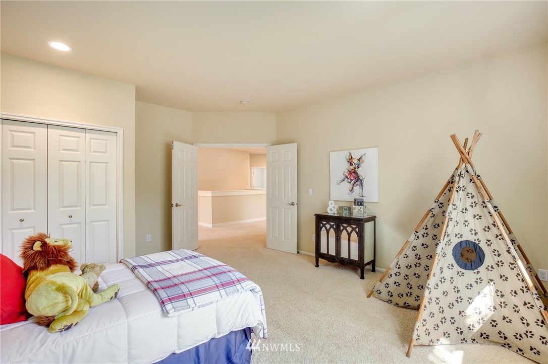807 South 36th Place Renton, WA 98055 - Photo 31 of 39 a bedroom with a bed and a window