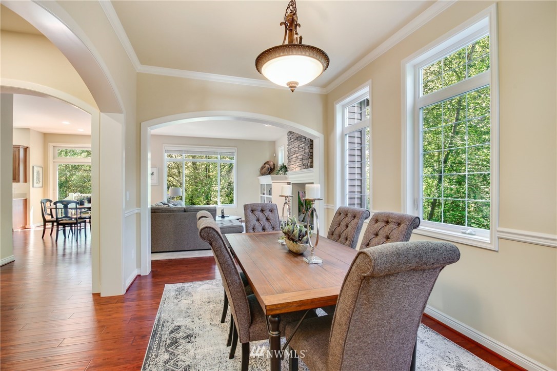 807 South 36th Place Renton, WA 98055 - Photo 7 of 39 a view of a dining room with furniture window and wooden floor