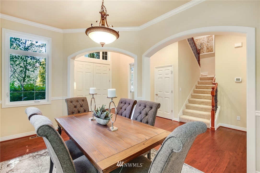807 South 36th Place Renton, WA 98055 - Photo 8 of 39 a view of a dining room with furniture window and wooden floor