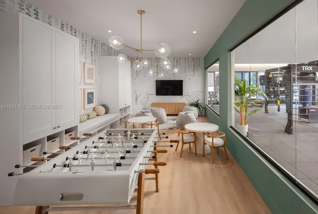 a very nice looking dining room with a large window