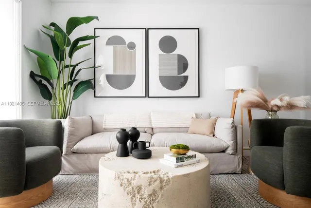 a living room with furniture and a potted plant