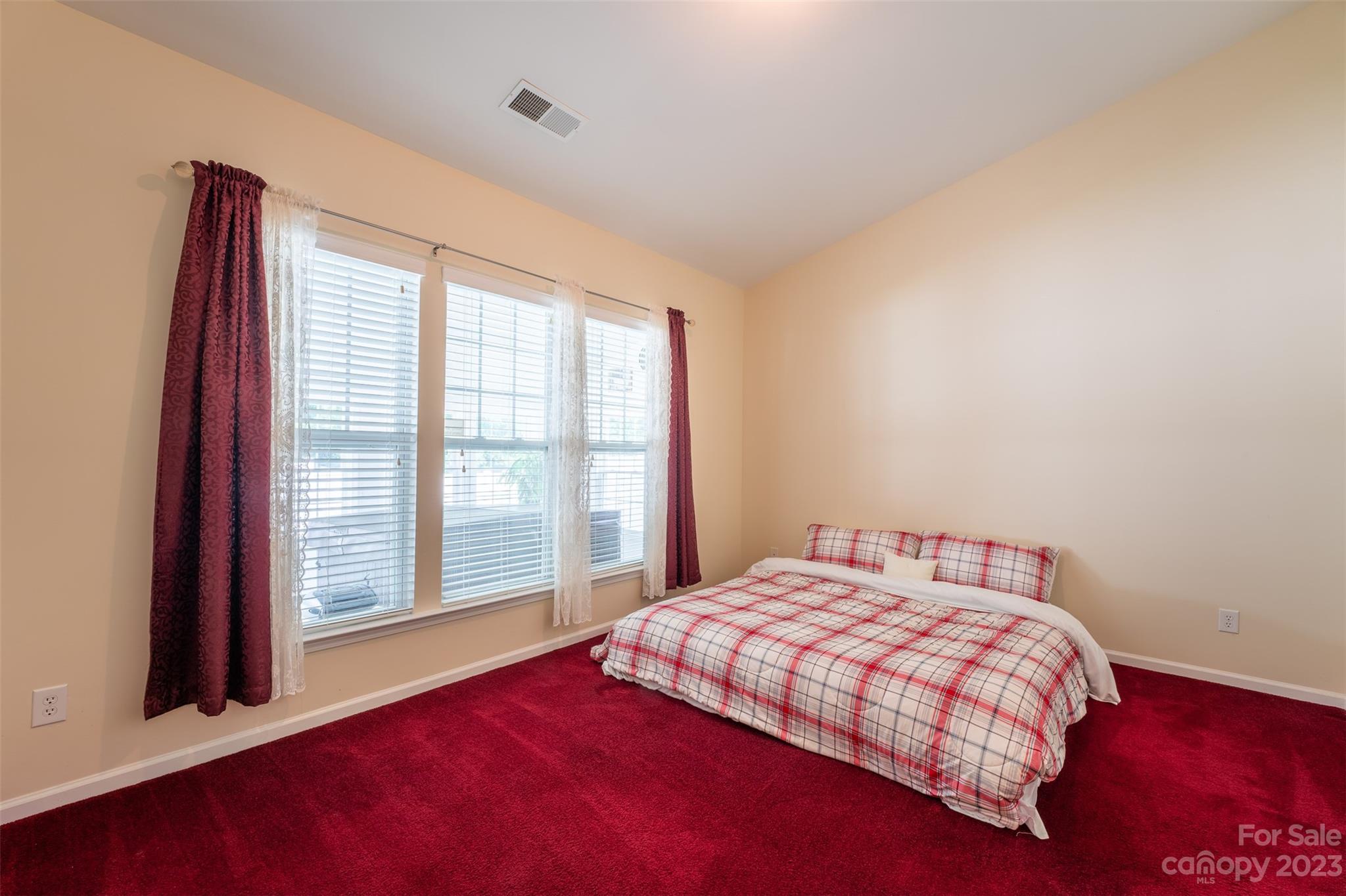 143 Whitley Mills Road Fort Mill, SC 29708 - Photo 18 of 28 a bedroom with a large bed and a large window