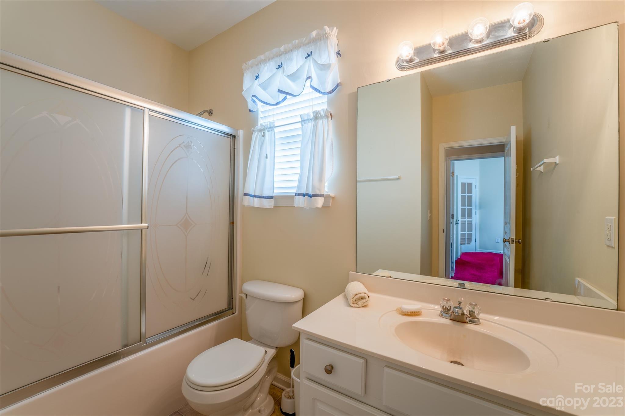 143 Whitley Mills Road Fort Mill, SC 29708 - Photo 24 of 28 a bathroom with a sink vanity mirror and toilet