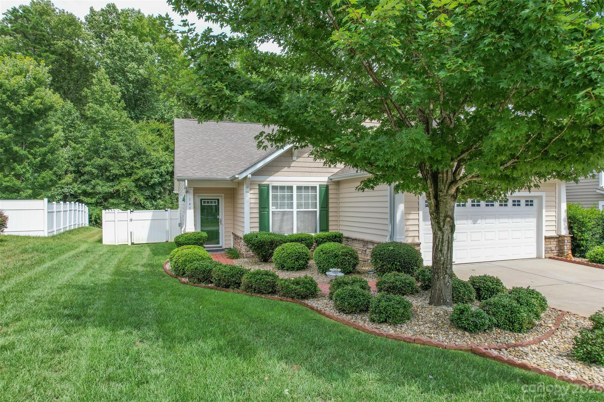 143 Whitley Mills Road Fort Mill, SC 29708 - Photo 3 of 28 a front view of a house with a yard and trees