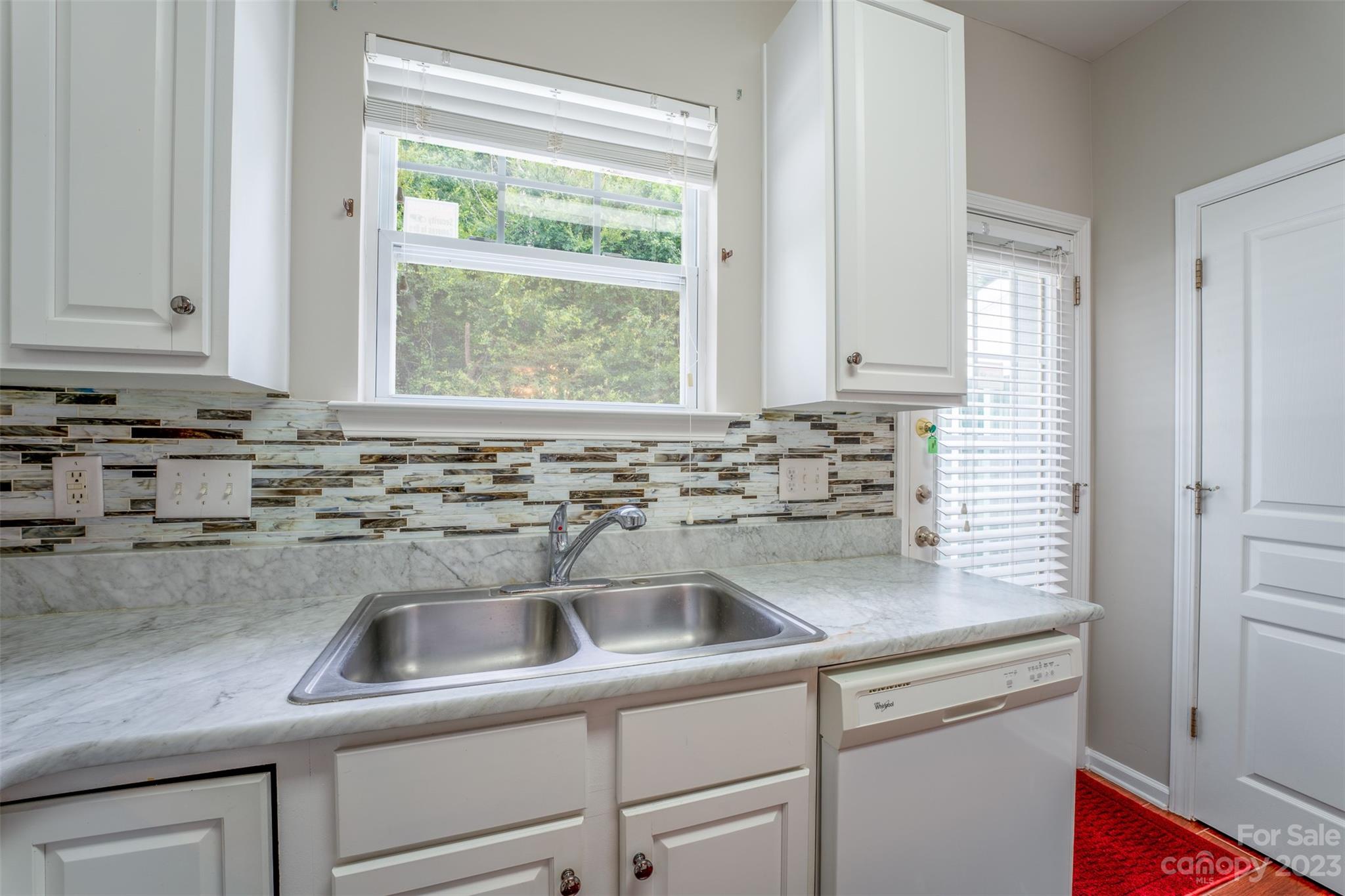 143 Whitley Mills Road Fort Mill, SC 29708 - Photo 6 of 28 a kitchen with stainless steel appliances granite countertop white cabinets and a sink