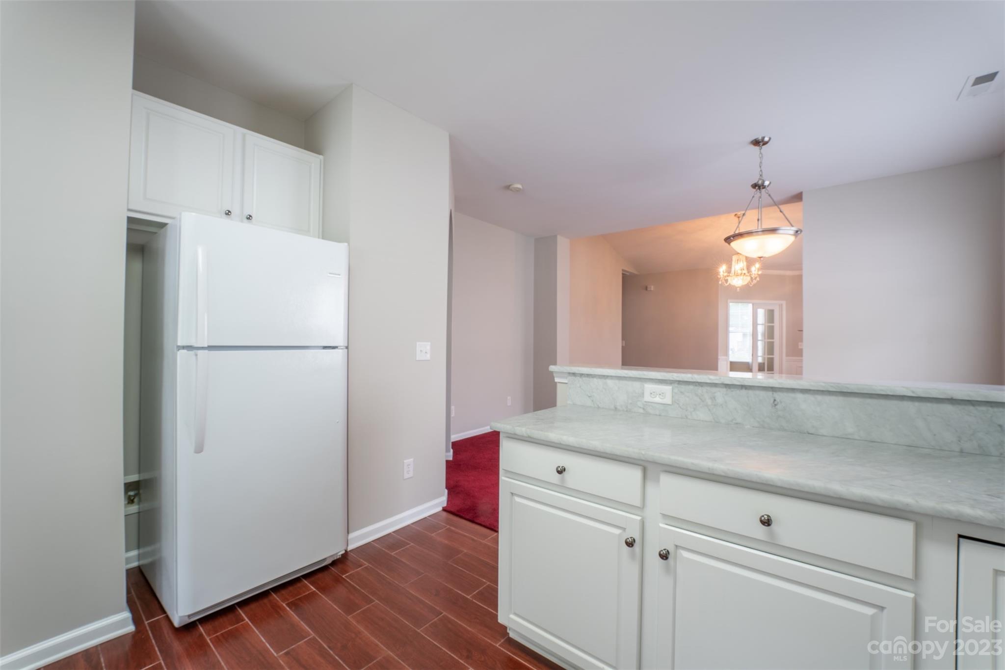143 Whitley Mills Road Fort Mill, SC 29708 - Photo 7 of 28 a kitchen with a refrigerator and a sink