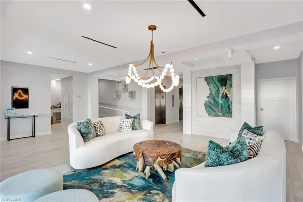 a living room with furniture and a rug
