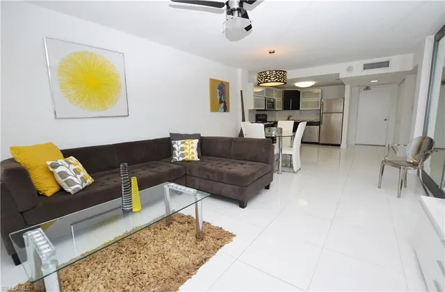 a living room with furniture and a rug