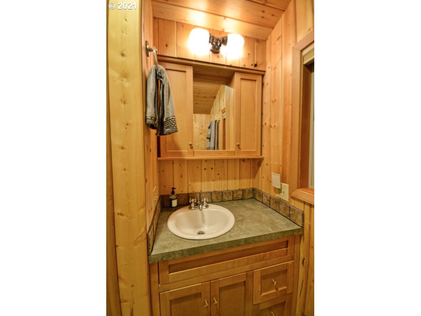 28730 Road 20 Rhododendron, OR 97049 - Photo 20 of 28 a bathroom with a sink and a mirror