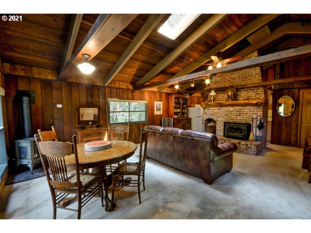 28730 Road 20 Rhododendron, OR 97049 - Photo 10 of 28 a view of a livingroom with furniture and a fireplace
