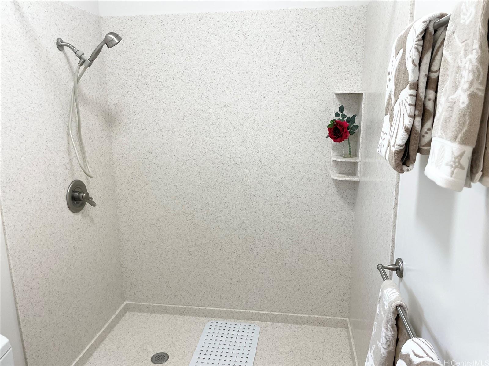 457 Halemaumau Street Honolulu, HI 96821 - Photo 14 of 25 a bathroom with a shower and a sink