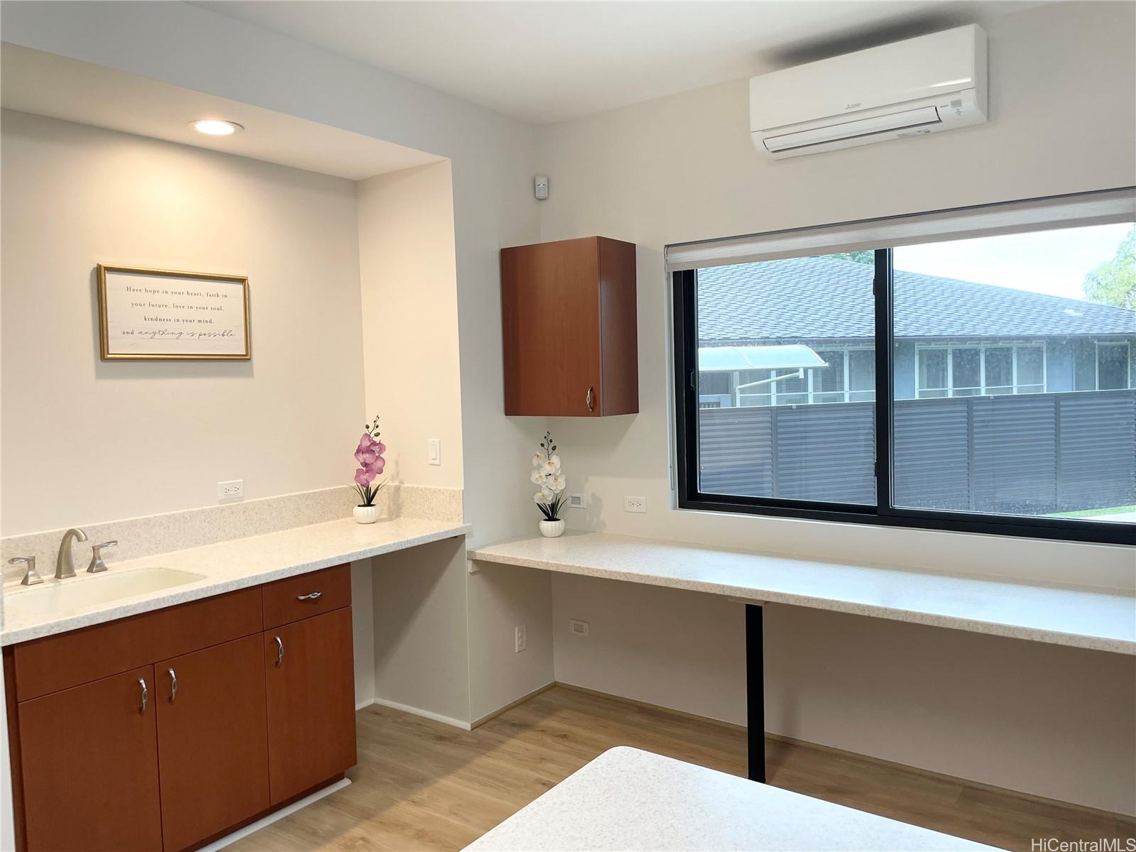 457 Halemaumau Street Honolulu, HI 96821 - Photo 18 of 25 a bathroom with a sink and a mirror