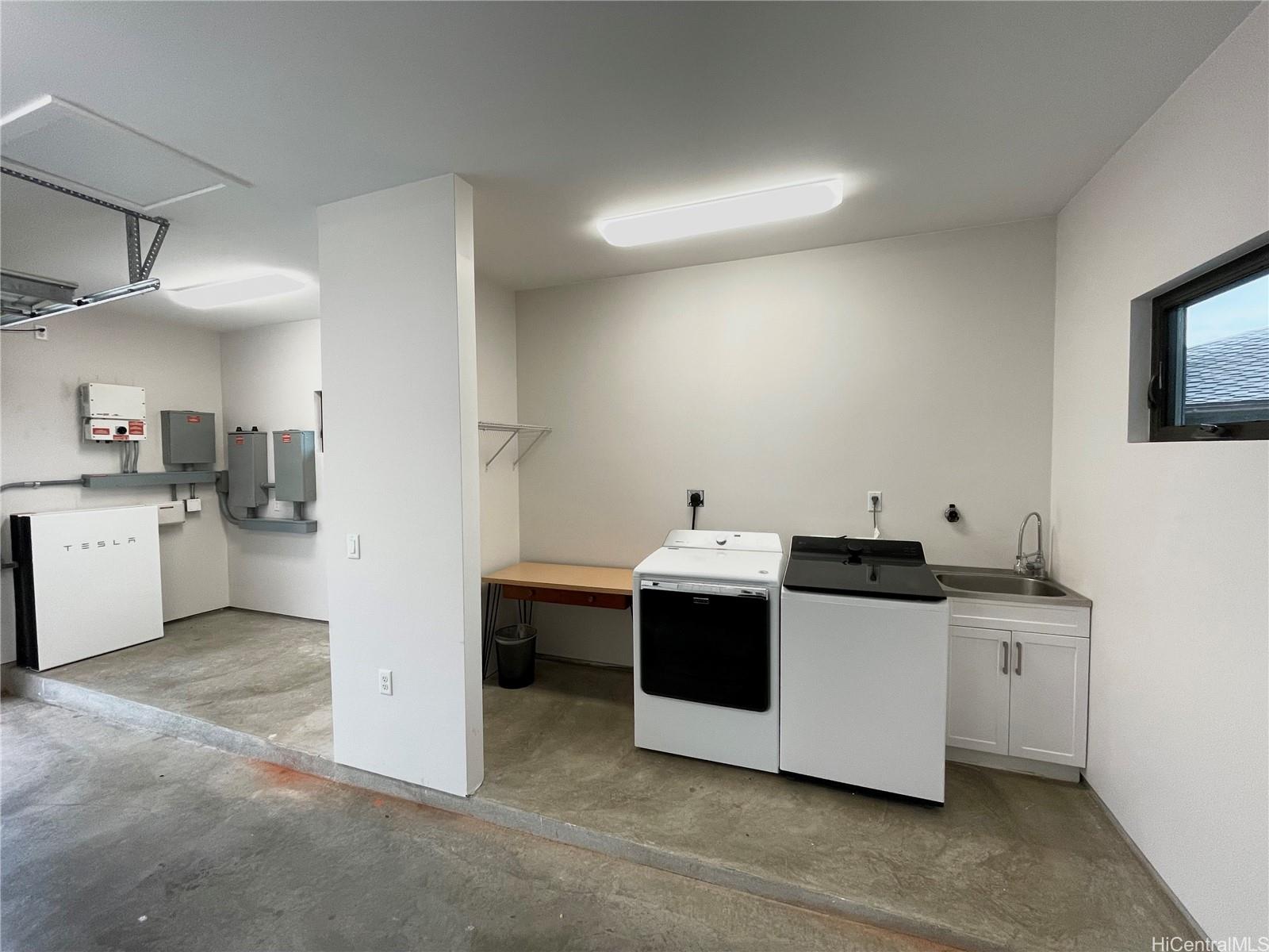 457 Halemaumau Street Honolulu, HI 96821 - Photo 22 of 25 a kitchen with stainless steel appliances a sink and cabinets