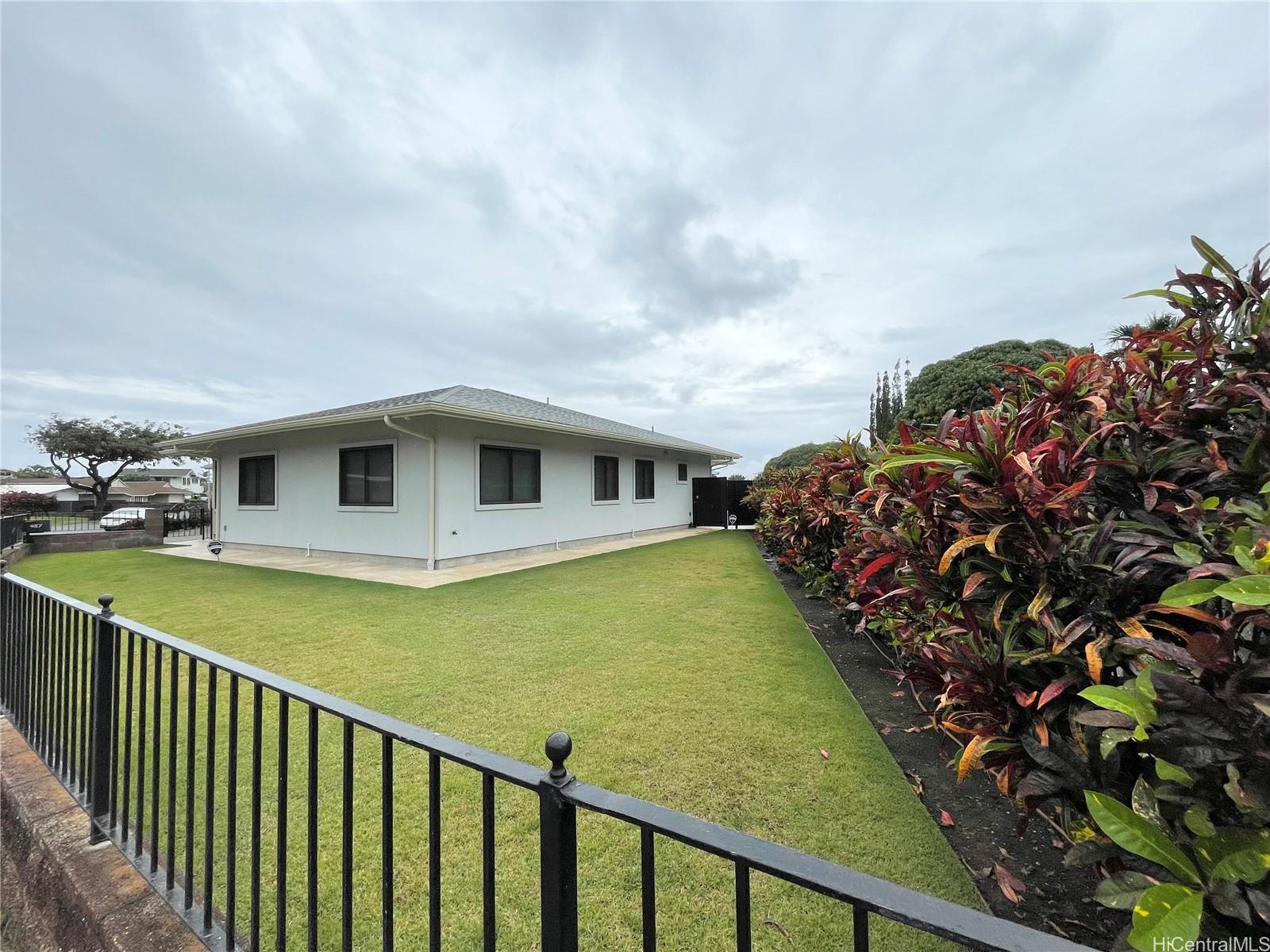 457 Halemaumau Street Honolulu, HI 96821 - Photo 3 of 25 a front view of a house with a garden