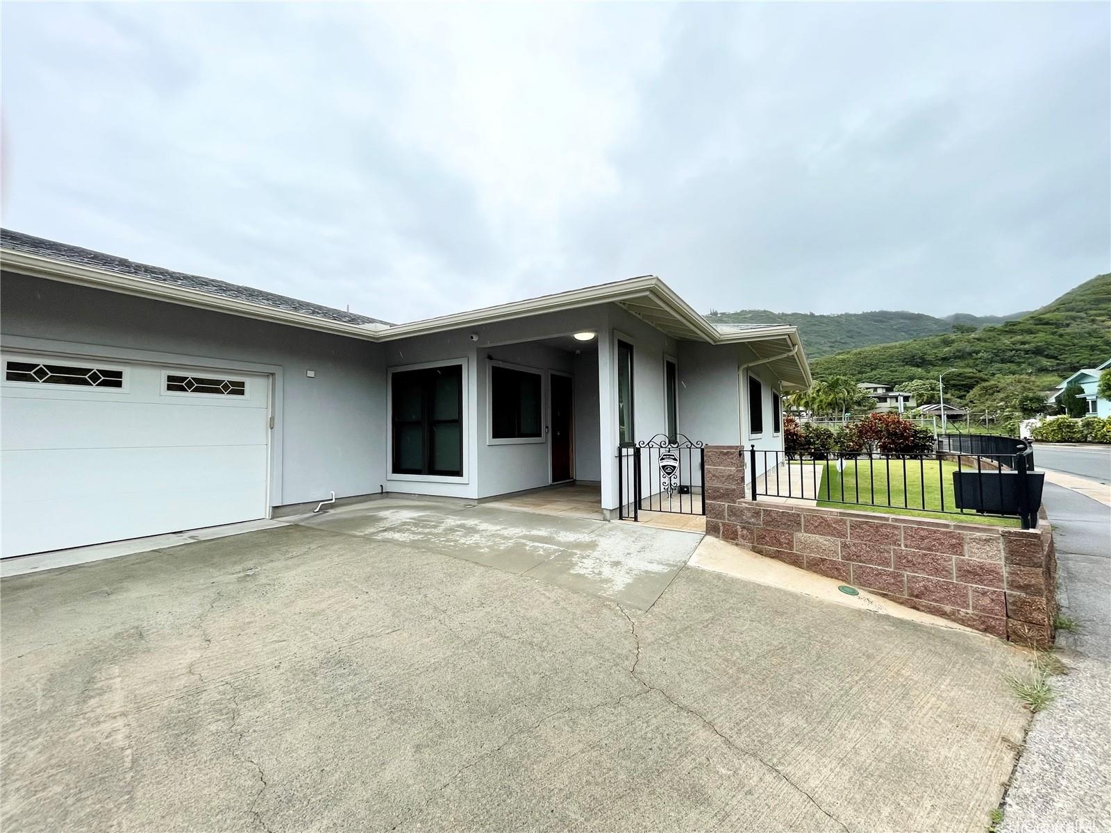 457 Halemaumau Street Honolulu, HI 96821 - Photo 4 of 25 a view of a house with backyard and porch