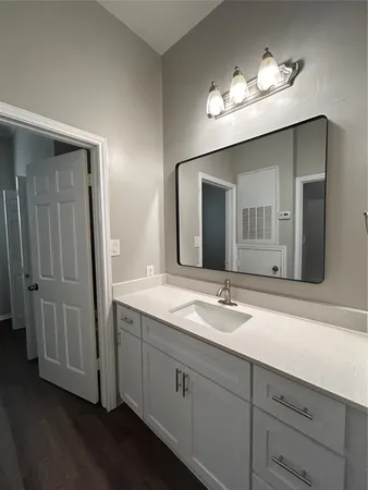 a white bath tub sitting next to a white toilet and a sink