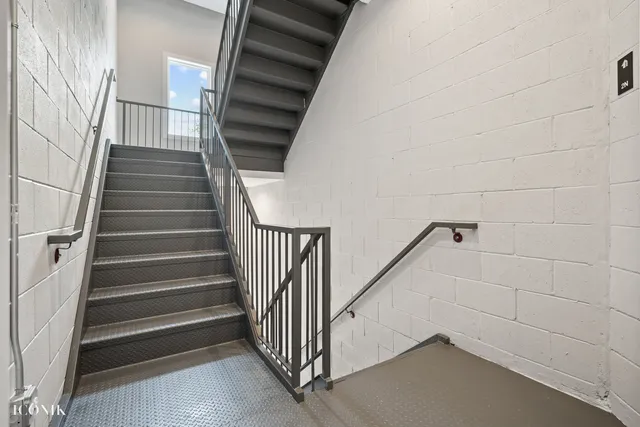 a view of a brick house with large windows