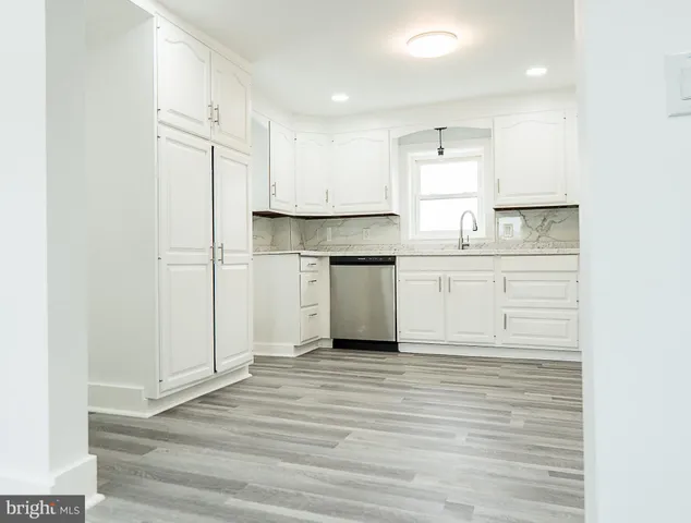 a view of kitchen with wooden floor