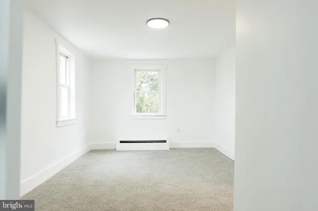 an empty room with windows