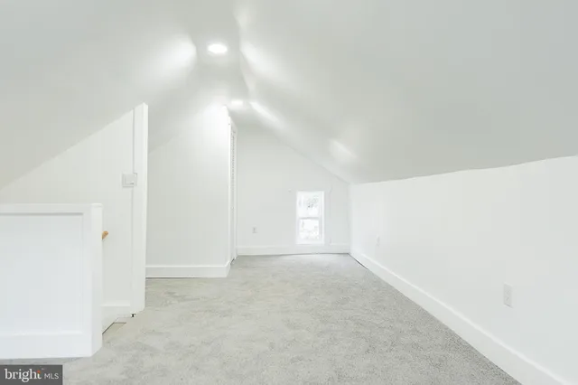 a view of a hallway with a white walls