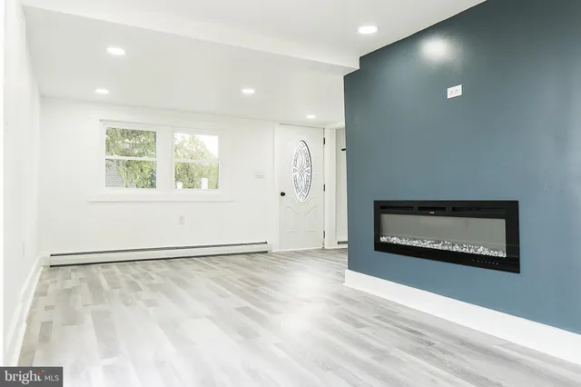 a view of an empty room and a window