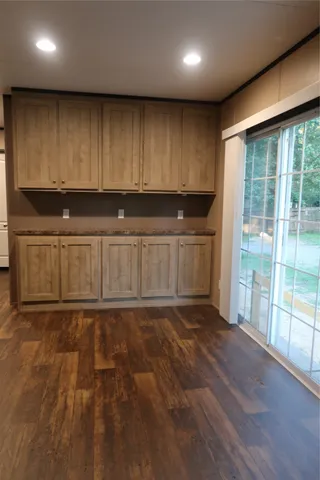 a view of a kitchen with a sink and a window