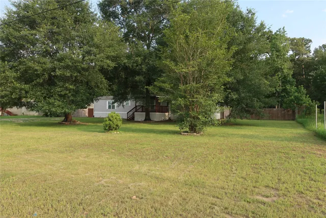 a house with swimming pool in front of it
